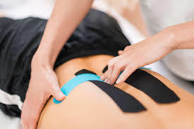 Patient receiving tape as part of treatment to help decompress the area and promote blood flow. 